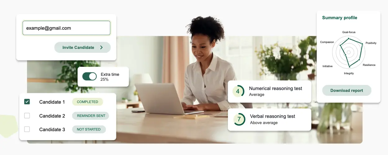 woman looking at computer and smiling taking test