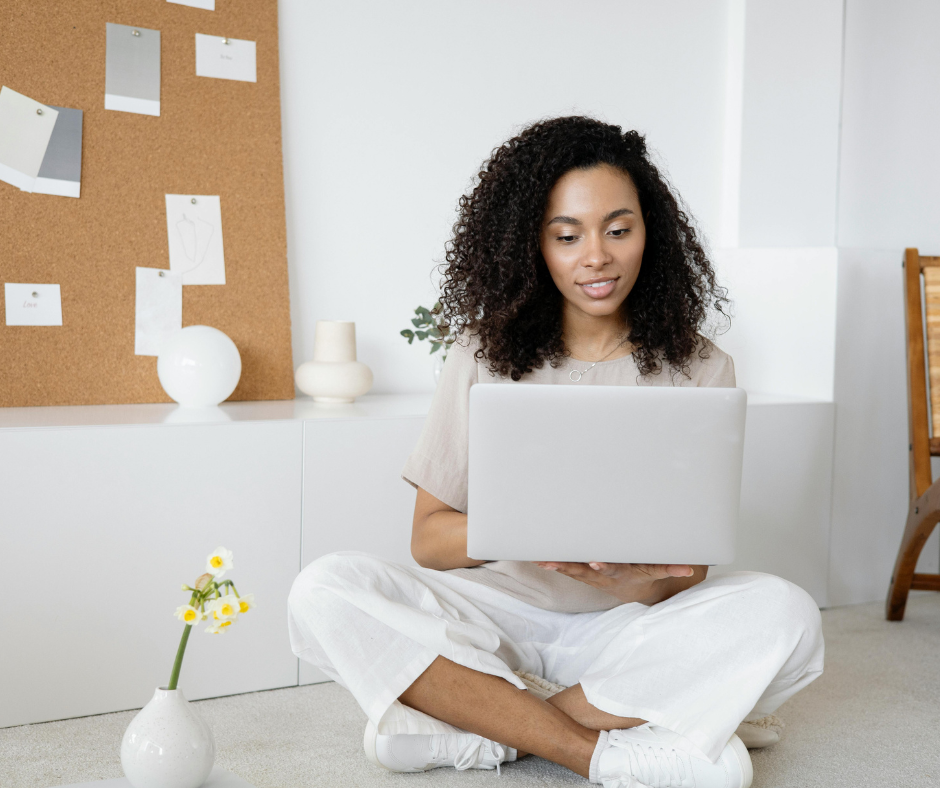 med spa marketing manager sitting on ground with legs crossed and evaluating marketing channels for your med spa