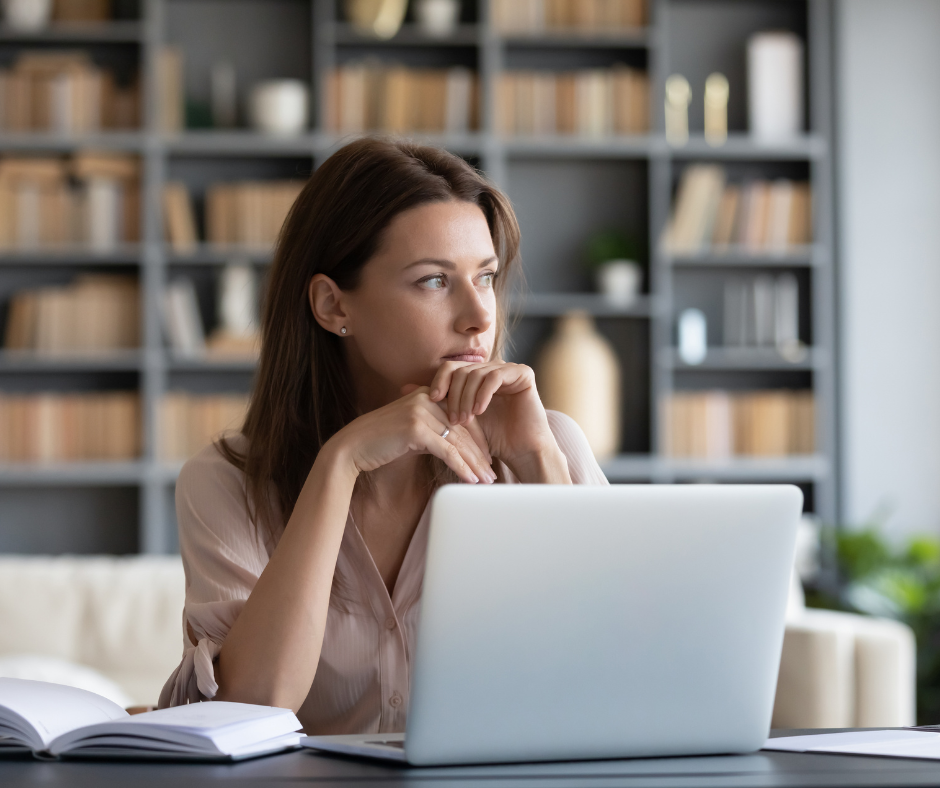 woman sitting at computer thinking about growth99 alternatives