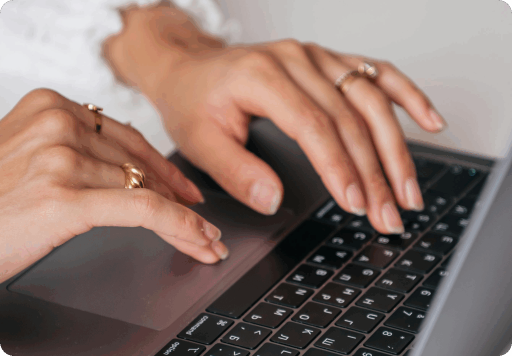 prospective patient with limited mobility typing on keyboard of computer