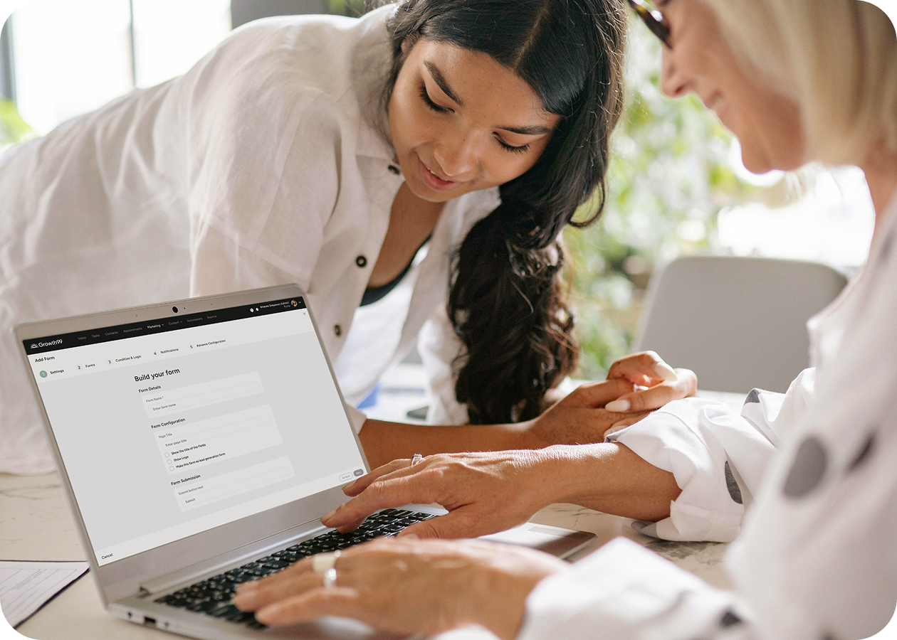 two women looking at med spa results on growth99 product excited at success