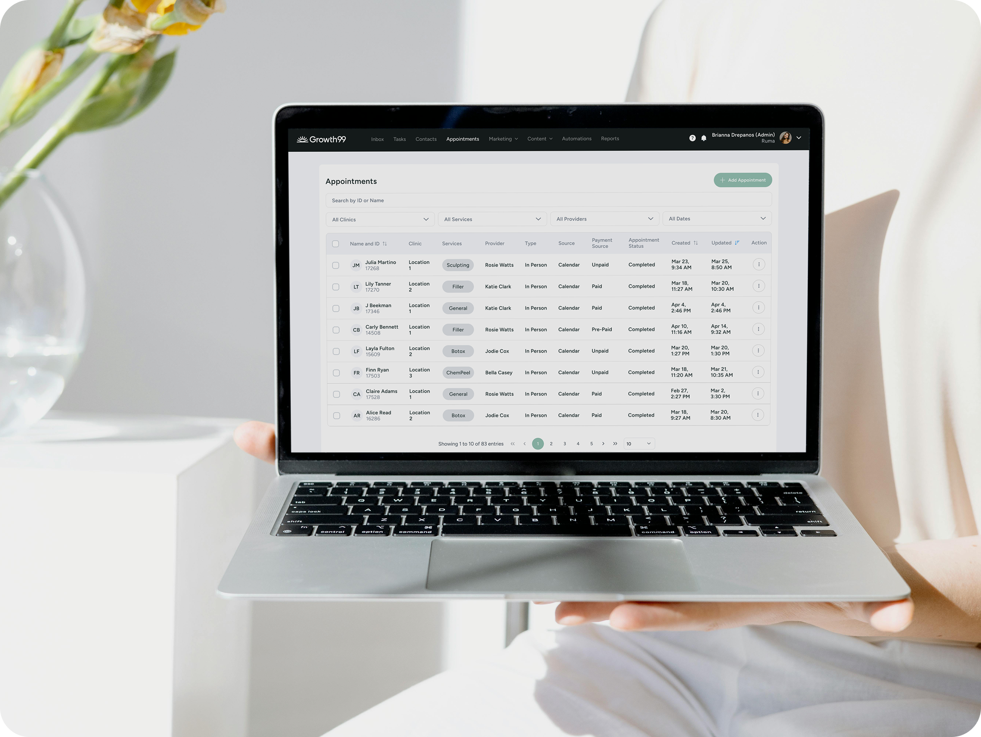 med spa owner showing camera a full list of leads in the Growth99 product